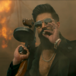 Yash as Raya in Toxic movie teaser holding gun and walking through smoke”